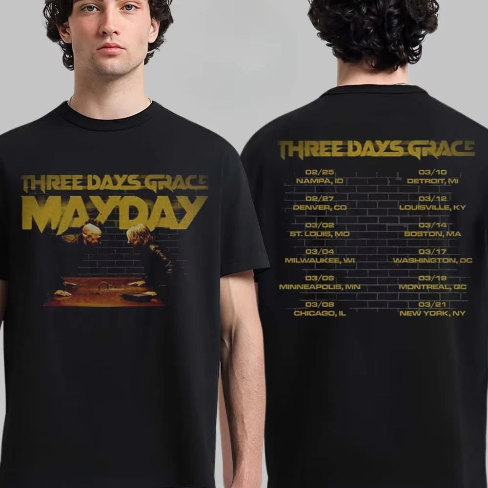 A man modeling a black graphic T-shirt, showing both the front and back views. The shirt features gold and yellow text reading 'THREE DAYS GRACE' and 'MAYDAY' on the front, and a list of tour dates on the back.